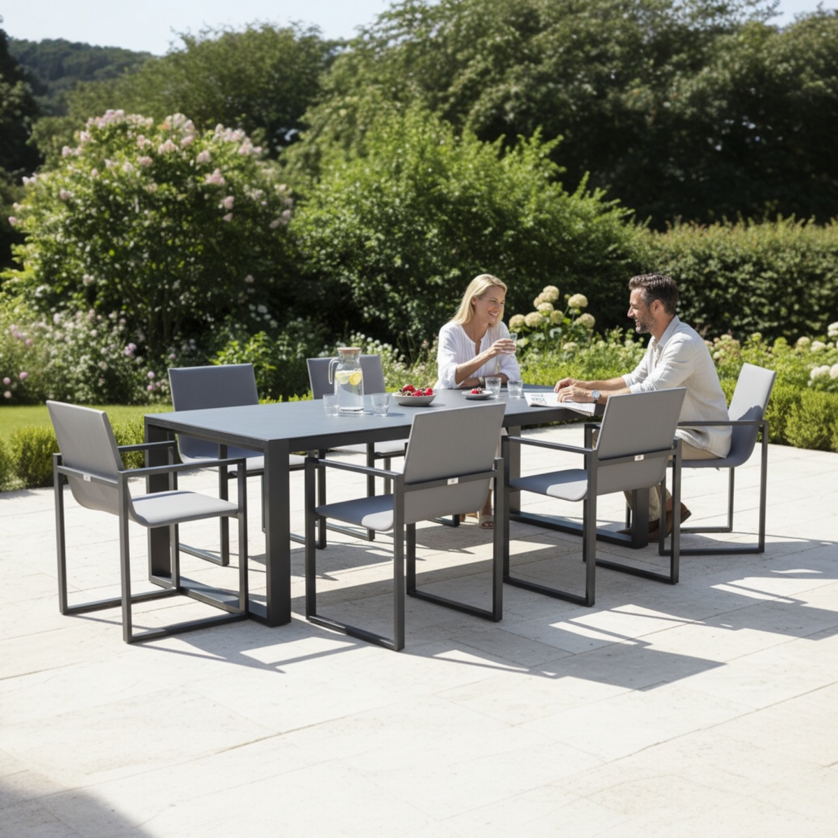 Como black aluminum ceramic-top outdoor dining table – shown outdoors (3)