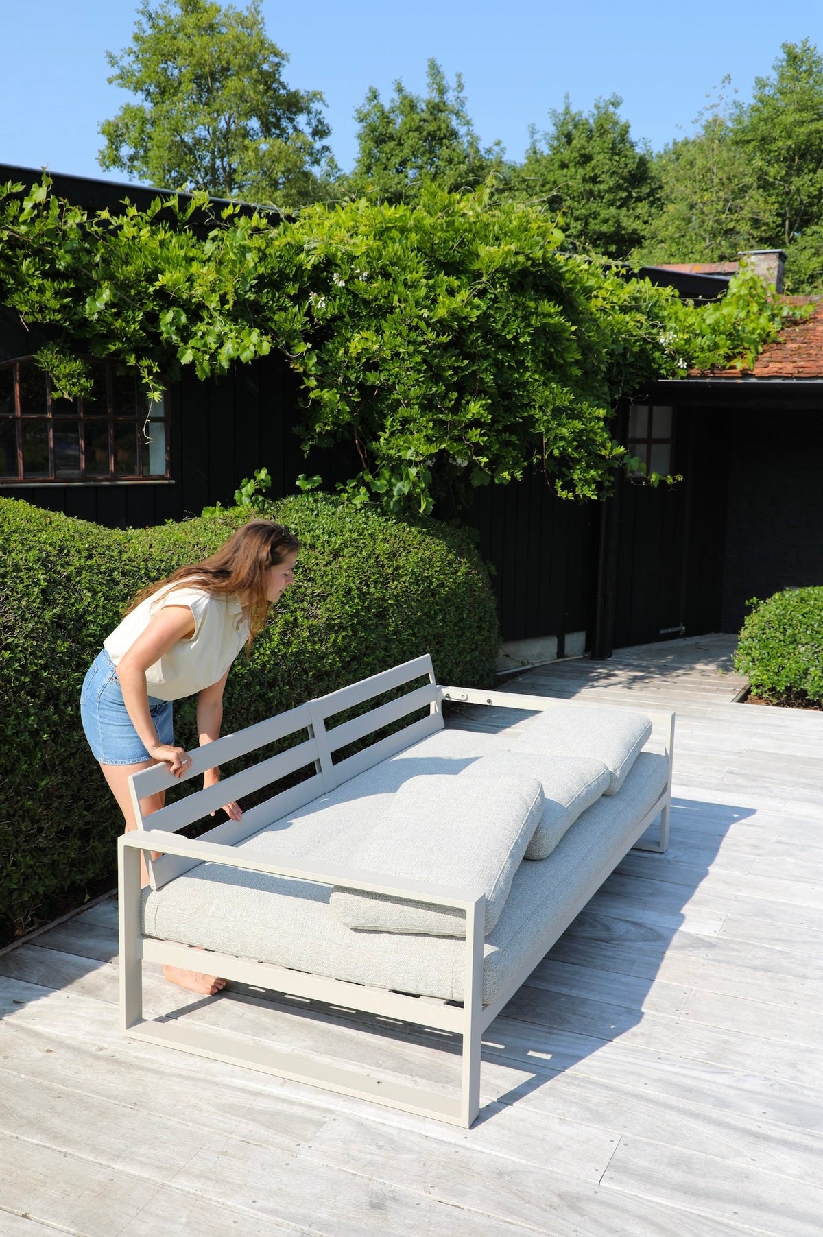Mael convertible aluminum outdoor sofa daybed – shown in use