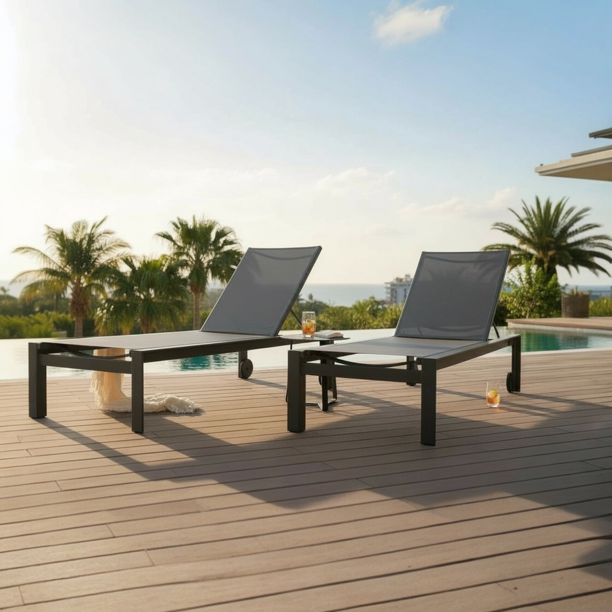 Nicky black aluminum chaise lounges, set of 2 with round table – shown outdoors