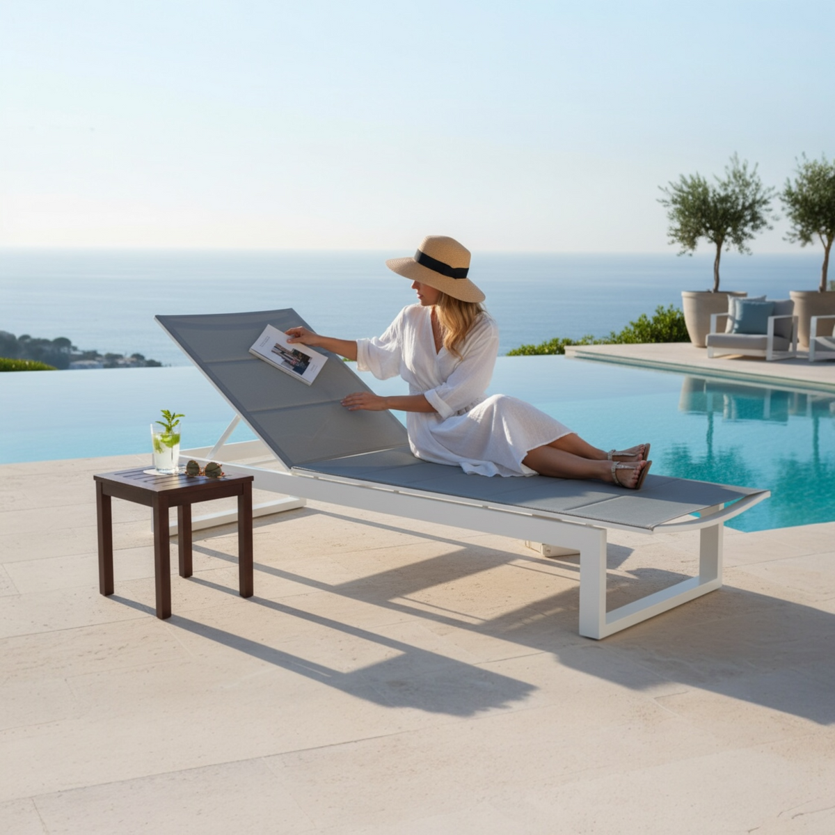 Como white aluminum chaise lounge with charcoal quilted sling – shown outdoors (3)