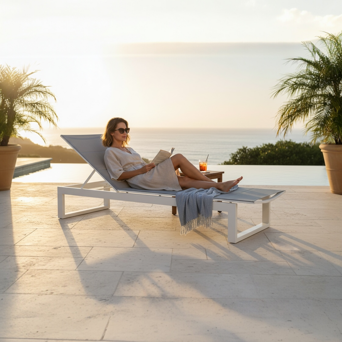 Como white aluminum chaise lounge with charcoal quilted sling – shown outdoors (4)
