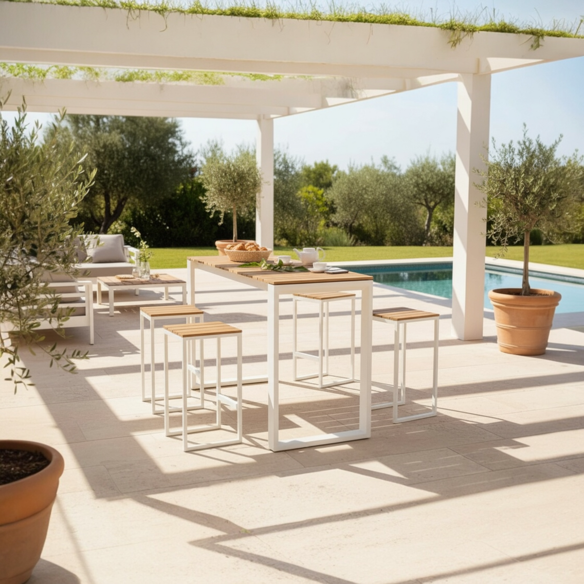 Como white aluminum and teak outdoor bar set with six stools – shown outdoors