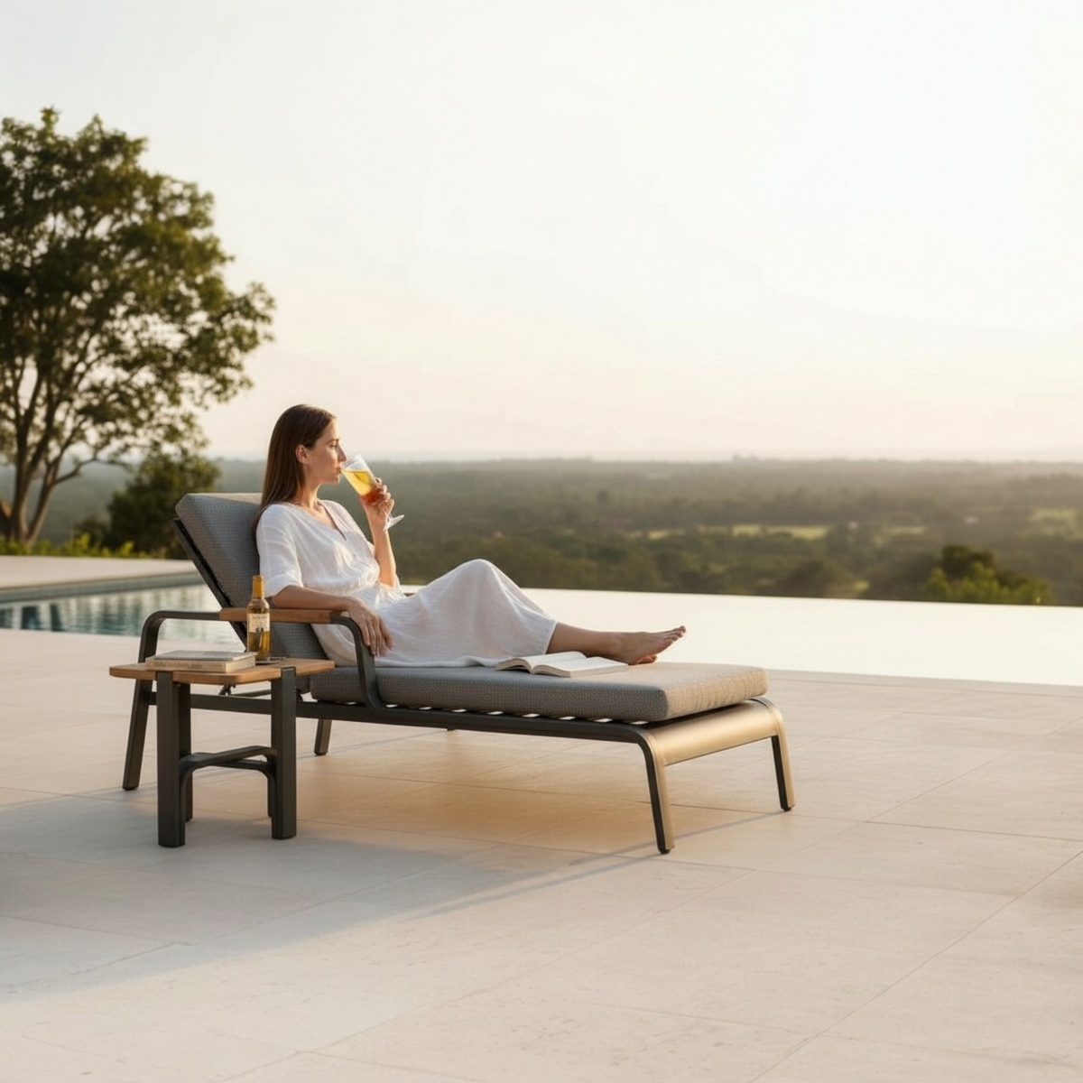 Viscounti black aluminum and teak chaise lounge with side table – shown outdoors
