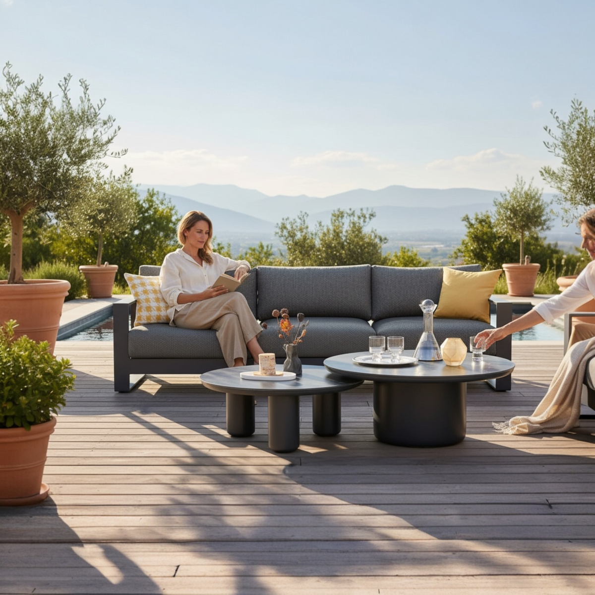 Iris extra-long black aluminum 3-seat outdoor sofa – shown outdoors (2)