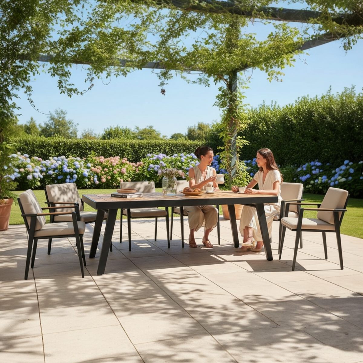 Lovy 8-seat aluminum and teak outdoor dining set – shown outdoors