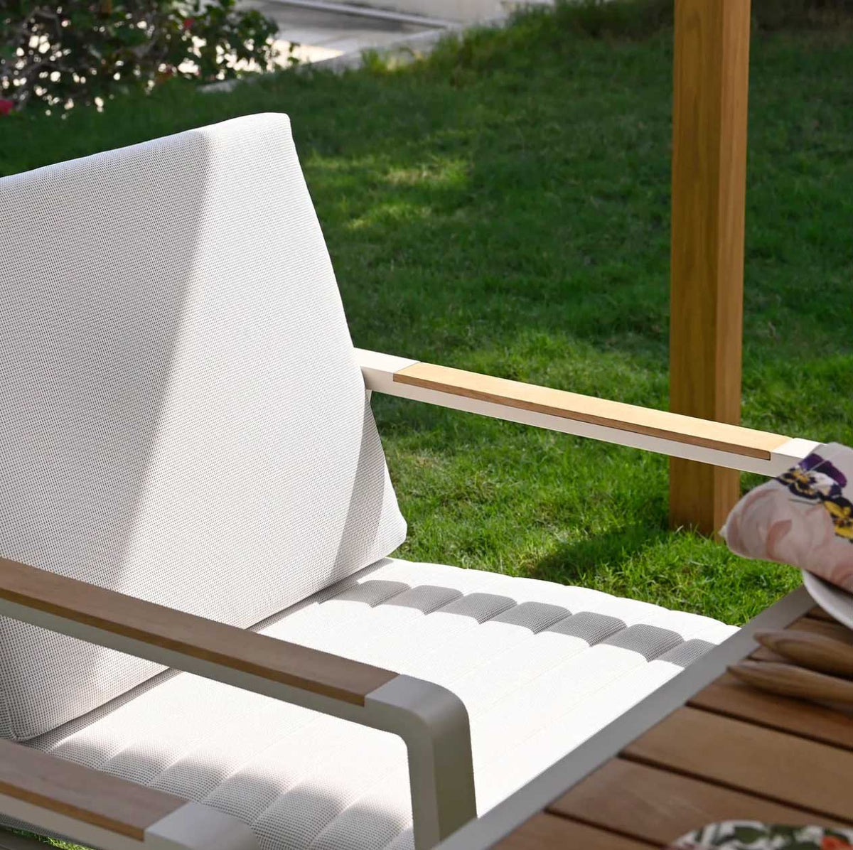Armchair from the Noffy compact square aluminum and teak dining set for four – close-up detail
