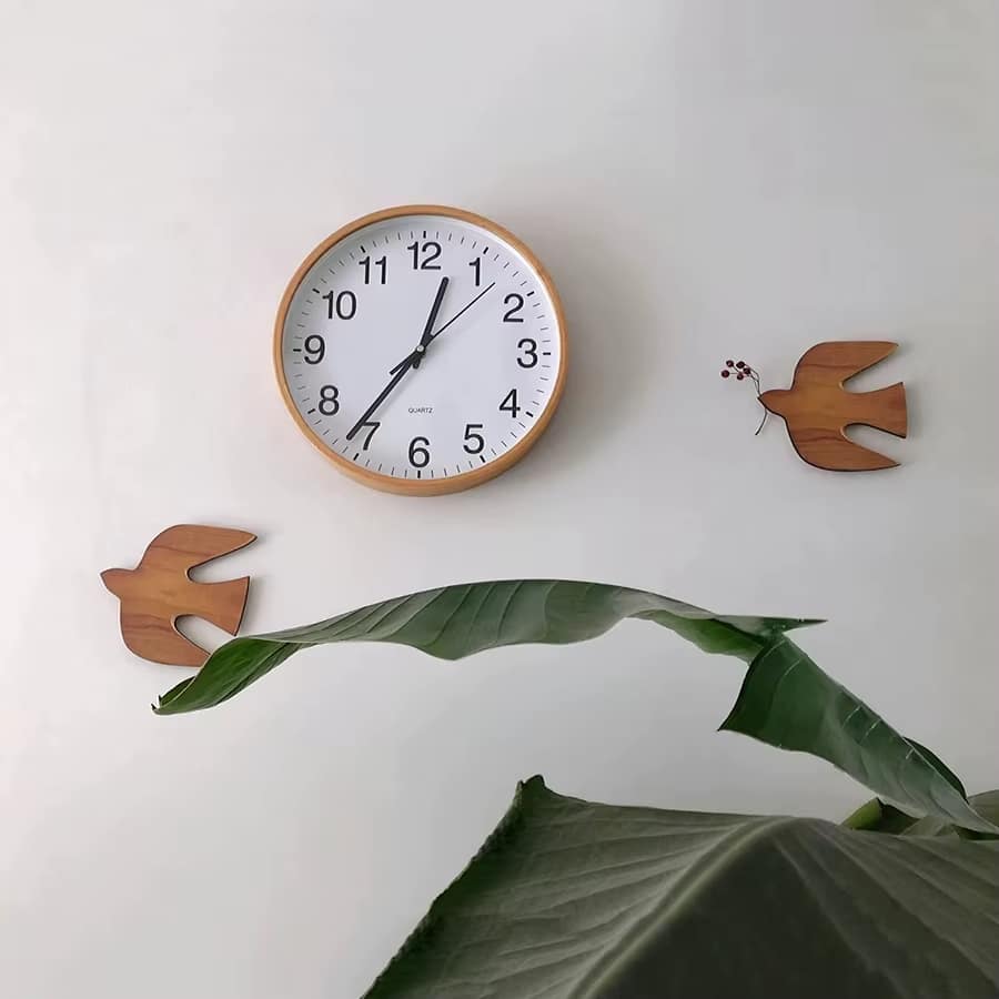Wooden swallow wall decor with spread wings – shown in a room setting