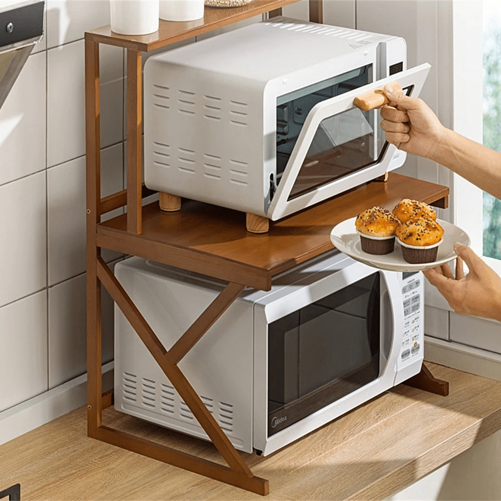 Bamboo microwave shelf with a raised top and compartments below – shown in a room setting