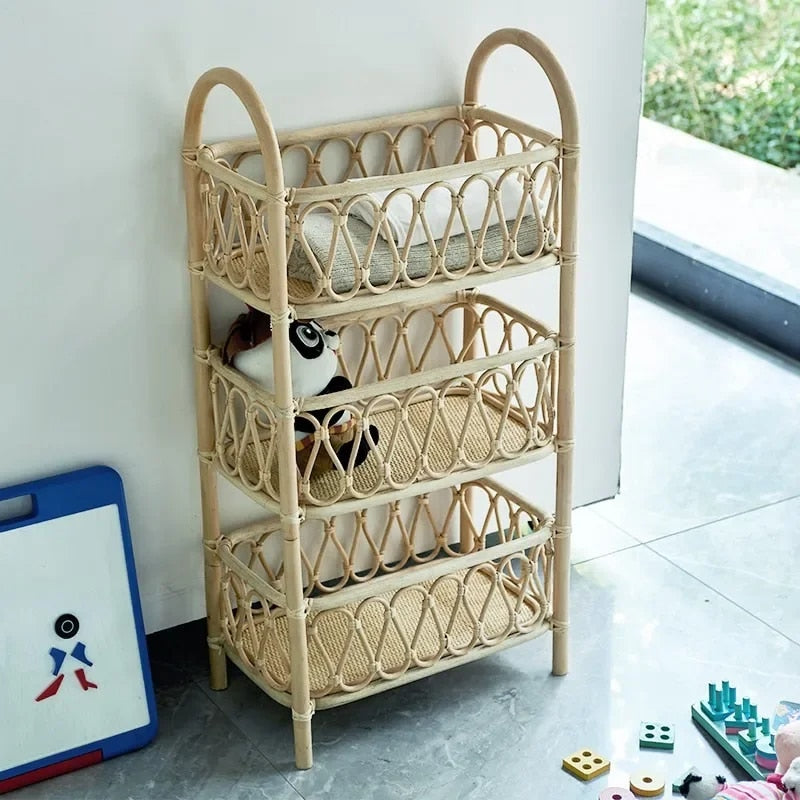 Beige three-tier rattan shelf unit on a wooden frame – shown in a room setting