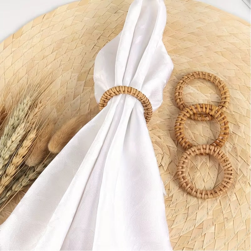 Set of twelve hand-braided rattan napkin rings – shown in a room setting