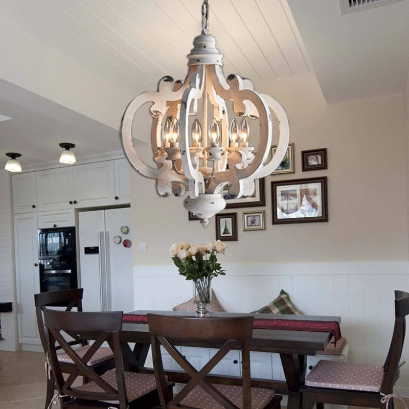 Retro handcrafted wood chandelier with visible filament bulbs – shown in a room setting