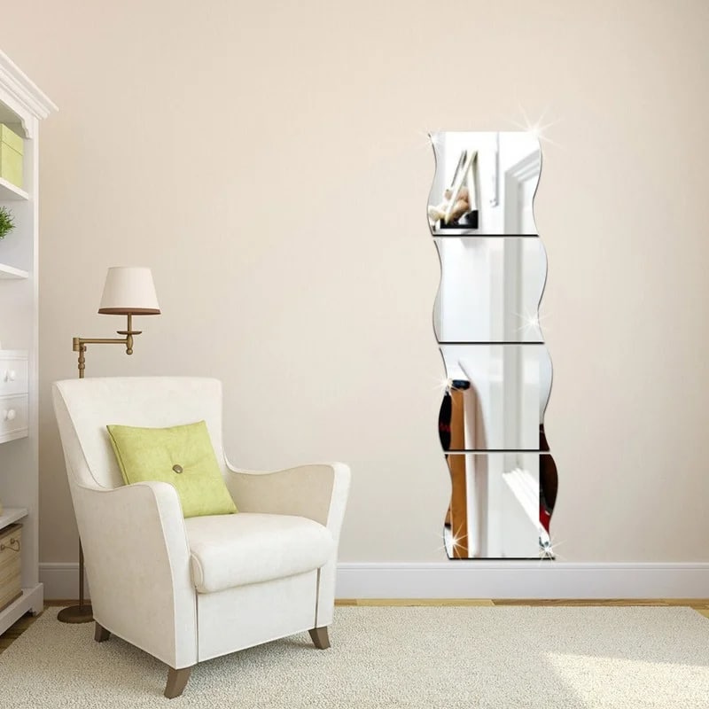 Geometric self-adhesive mirror panels applied to a door – shown in a room setting