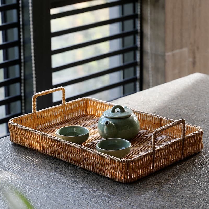 Brown plastic rattan-look tray with side handles – shown in a room setting (2)