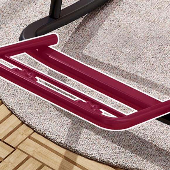 Modern black rattan rocking chair with a hand-braided seat – close-up detail