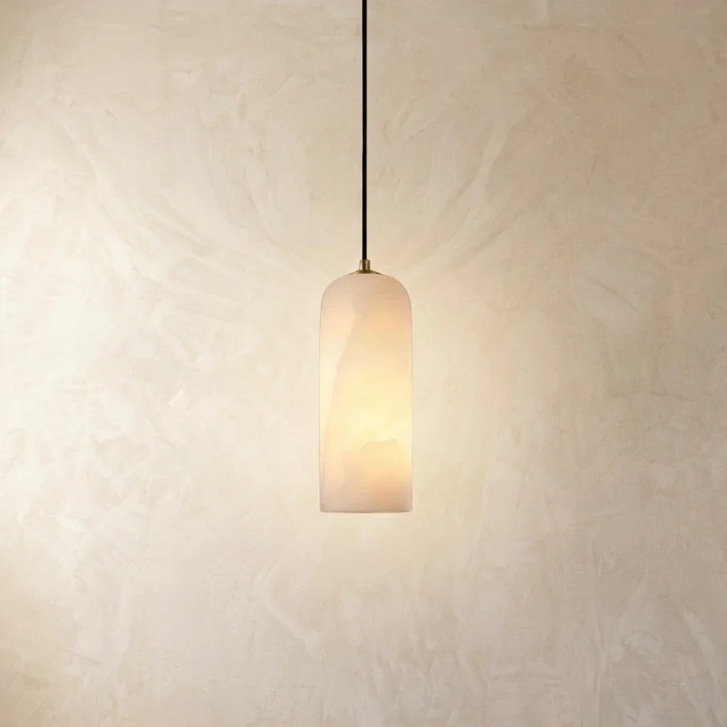 Tarente translucent marble pendant light with brushed brass canopy – shown in a room setting (4)