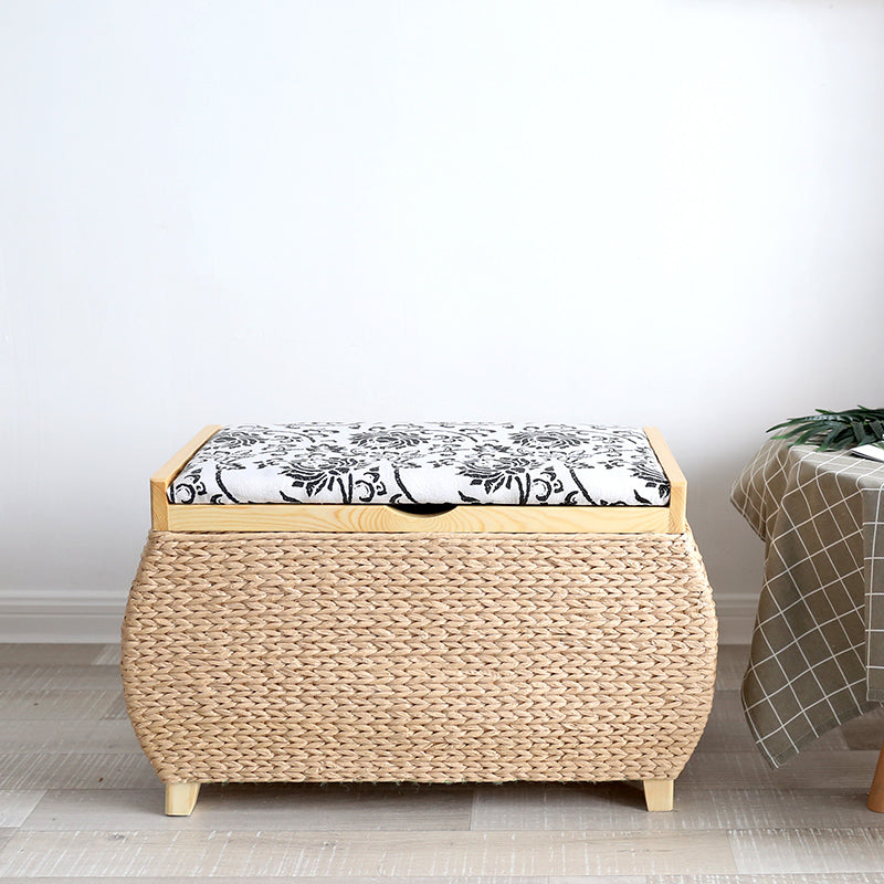Light rattan storage stool with black embroidered florals on the lid – another view