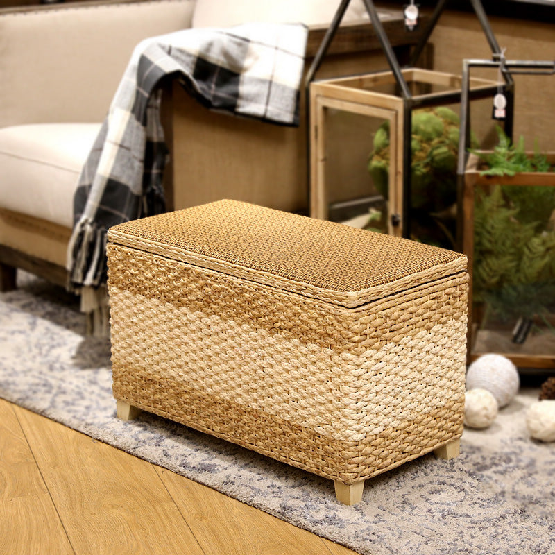 Rectangular hand-braided rattan storage stool with a removable lid – shown in a room setting (2)