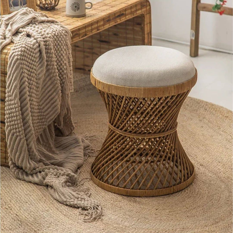 Japanese-style hourglass wicker stool with a cinched waist – gray variant, shown in a room setting