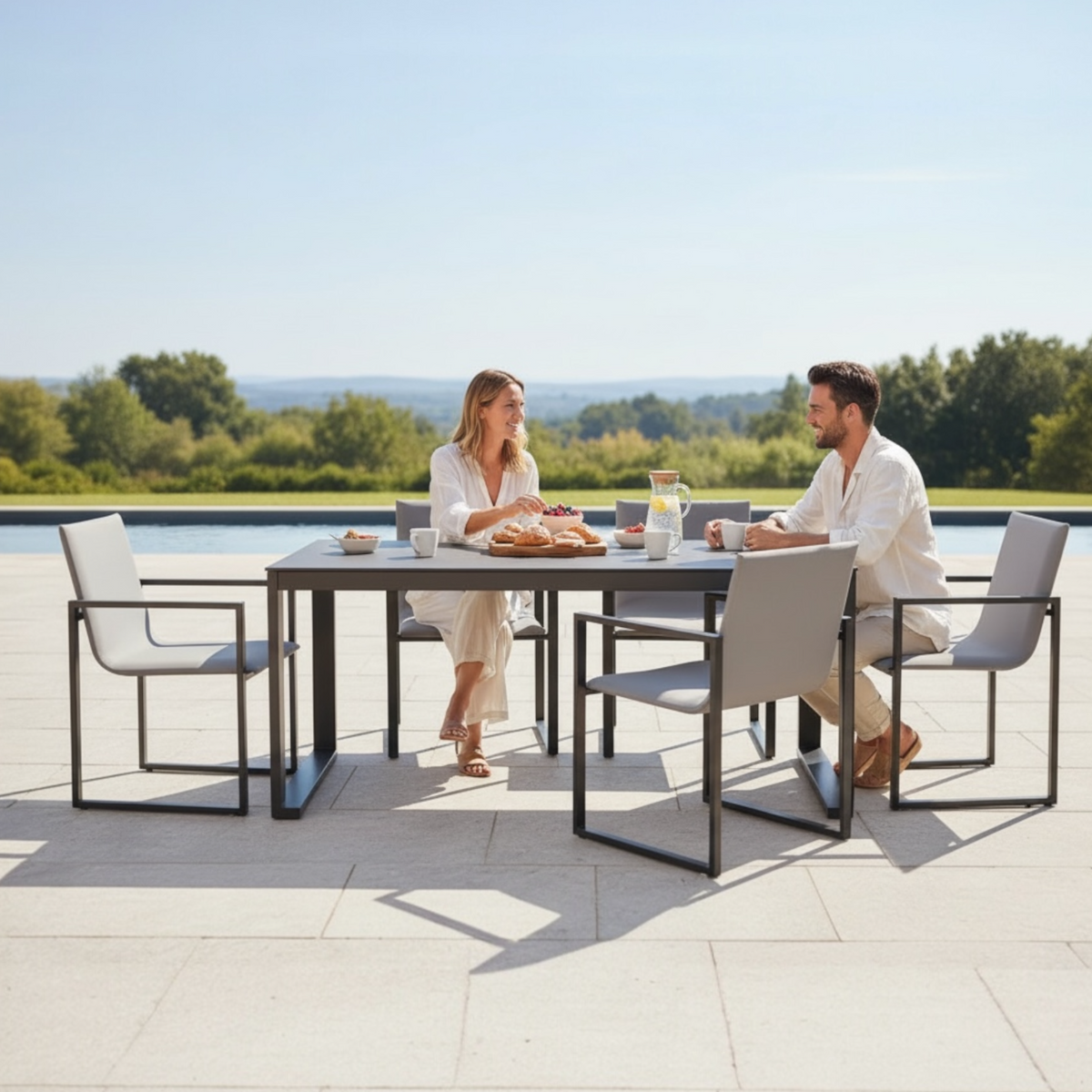 Como black aluminum ceramic-top outdoor dining table – shown outdoors (4)