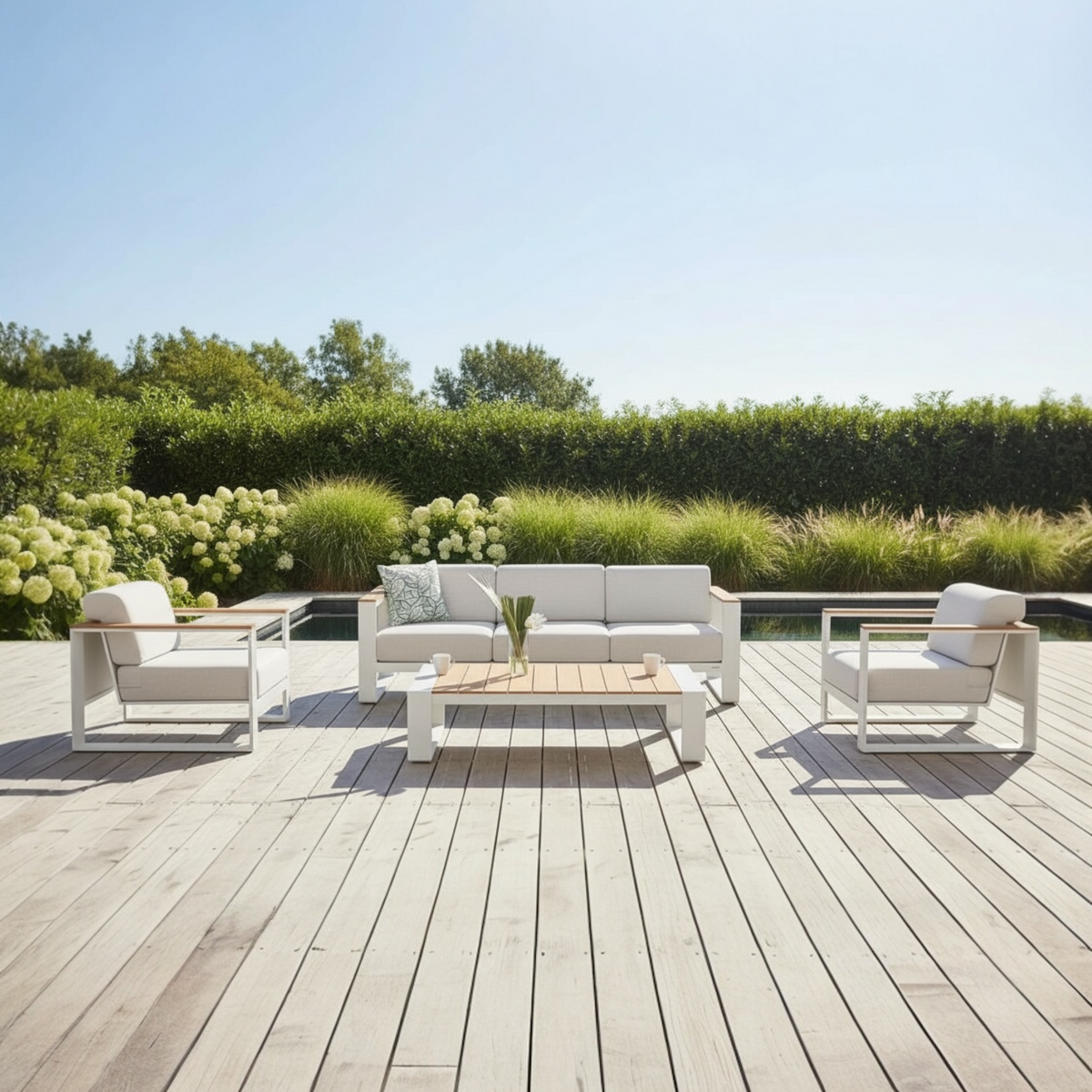 Sofy white aluminum and teak sofa set – shown outdoors