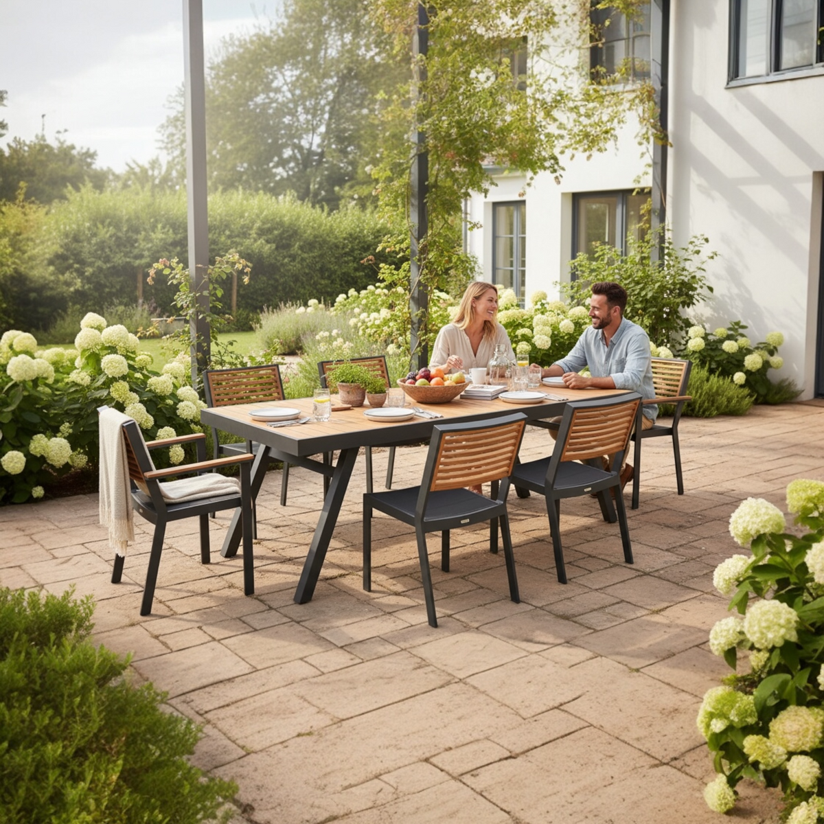 York black aluminum and teak dining set for six, 200 x 90 cm table – shown outdoors (2)