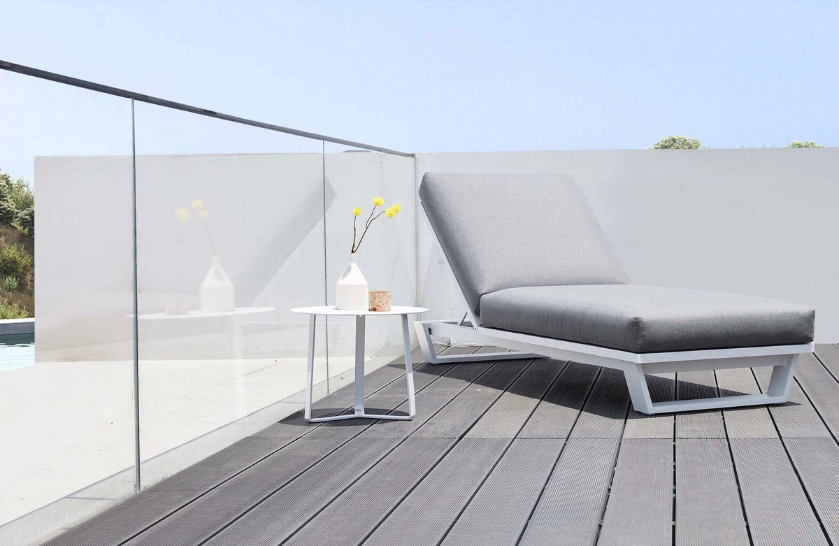 Pagino white aluminum chaise lounge with gray cushion – shown outdoors (3)