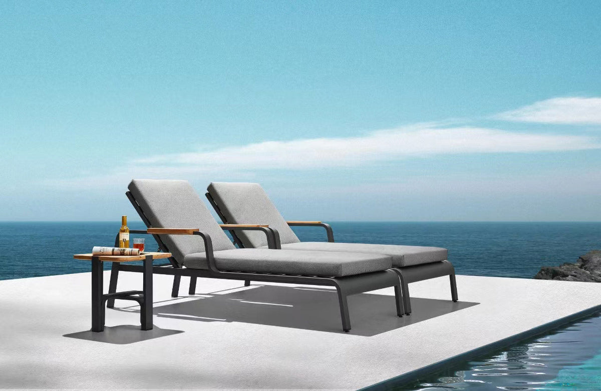 Viscounti black aluminum and teak chaise lounge with side table – shown outdoors (4)