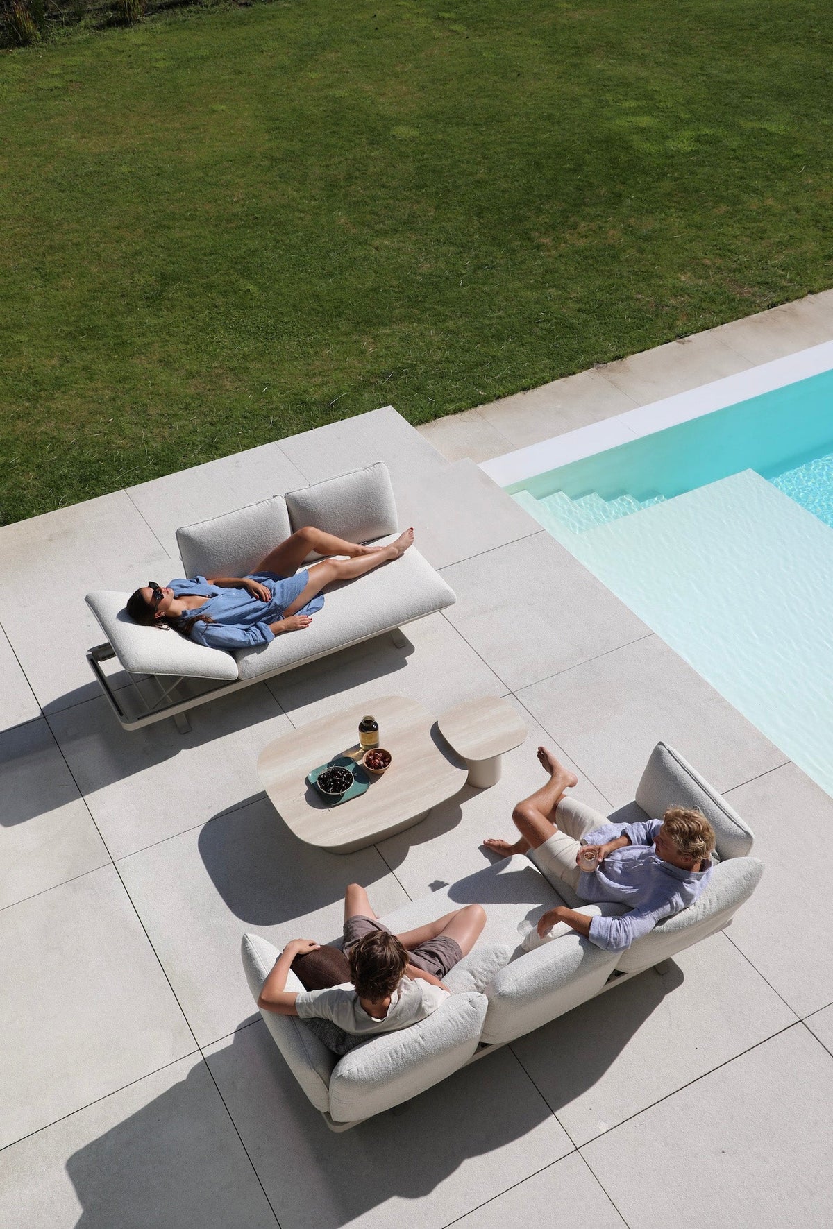 Camille 3-seat aluminum outdoor sofa that converts to a lounger – shown outdoors (3)