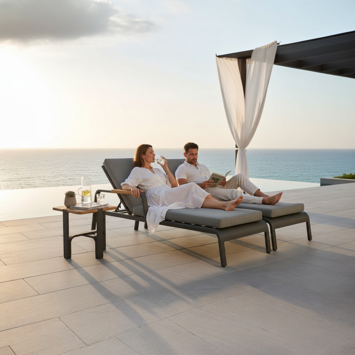 Viscounti black aluminum and teak chaise lounge with side table – shown outdoors (2)