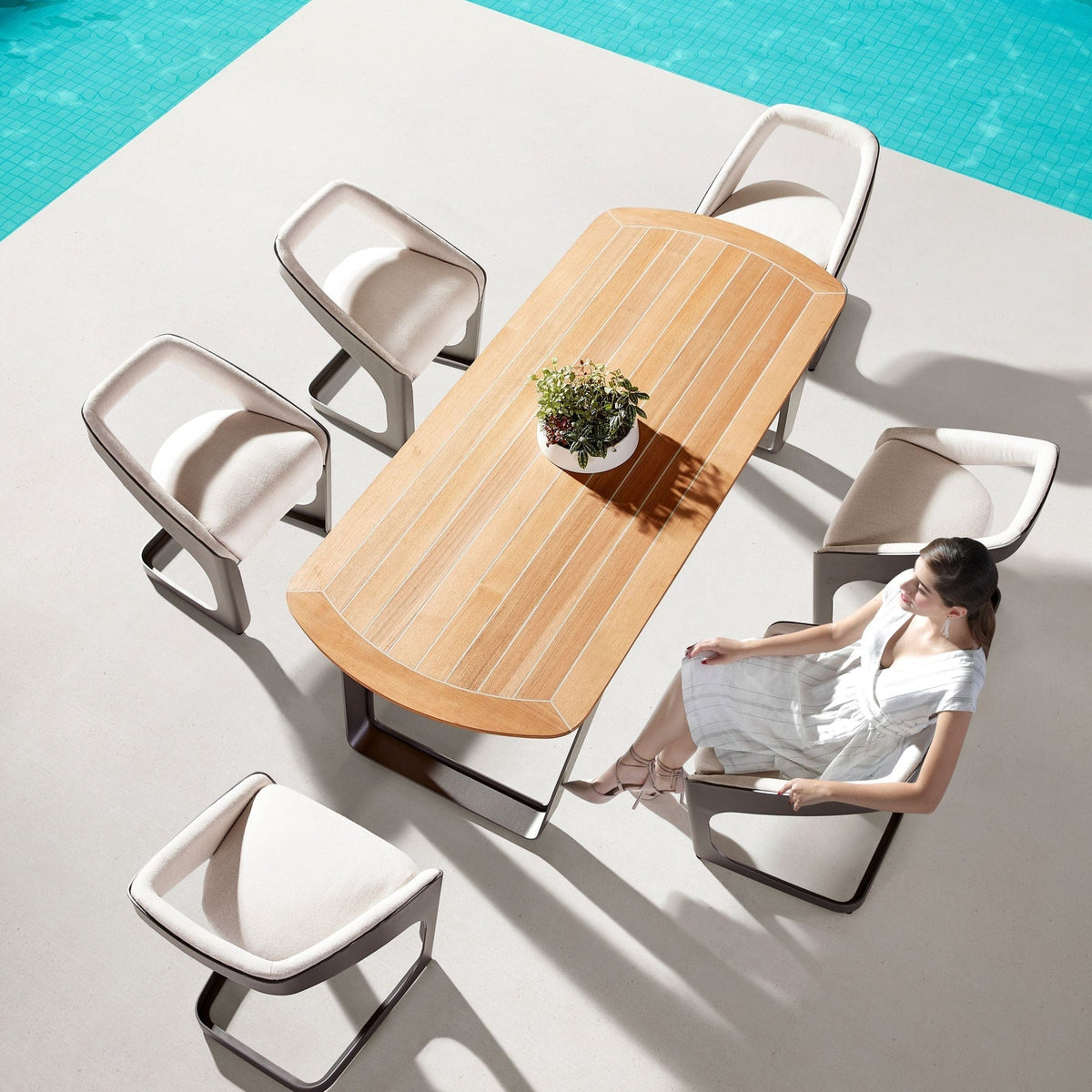 Onda aluminum and teak Sunbrella outdoor dining set – shown outdoors (3)
