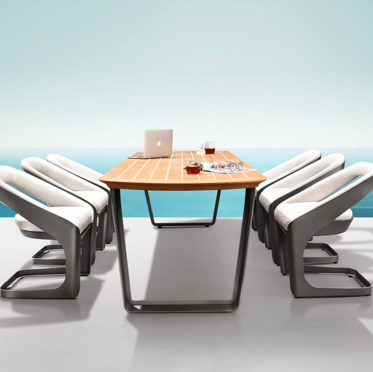 Onda aluminum and teak Sunbrella outdoor dining set – shown outdoors (5)