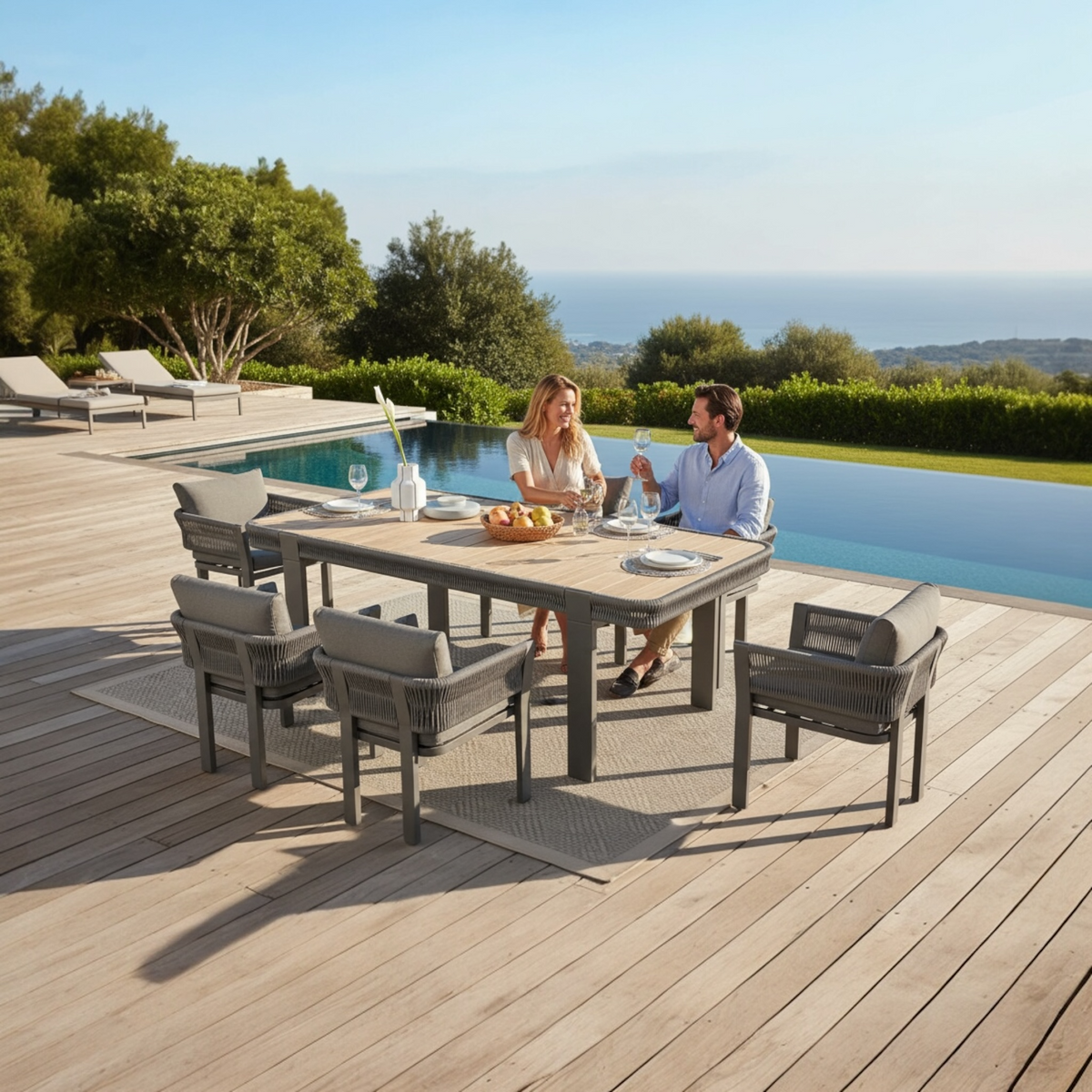 Olby black rope outdoor dining set with six armchairs and teak table – shown outdoors