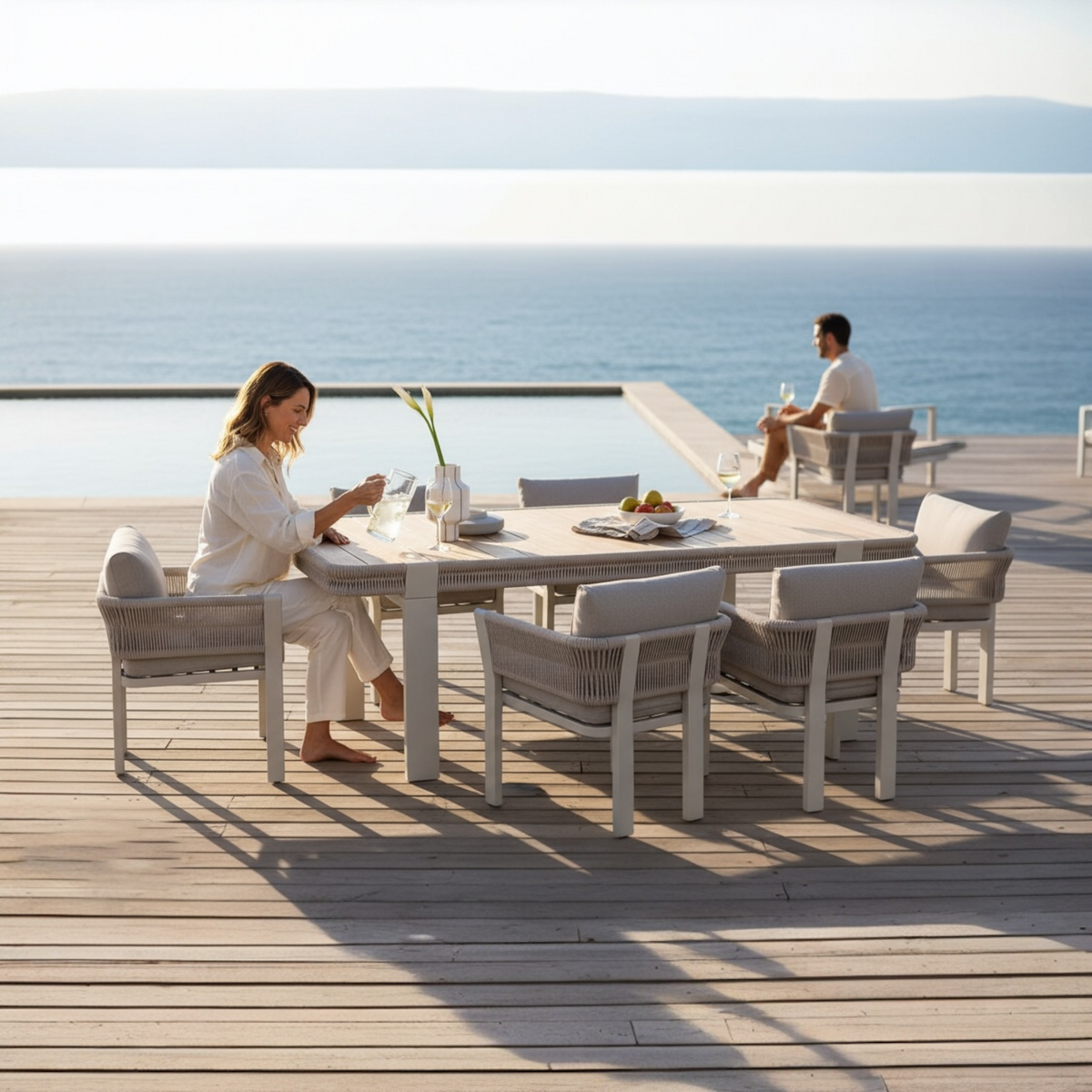 Olby 6-seat aluminum and rope outdoor dining set with teak-top table – shown outdoors