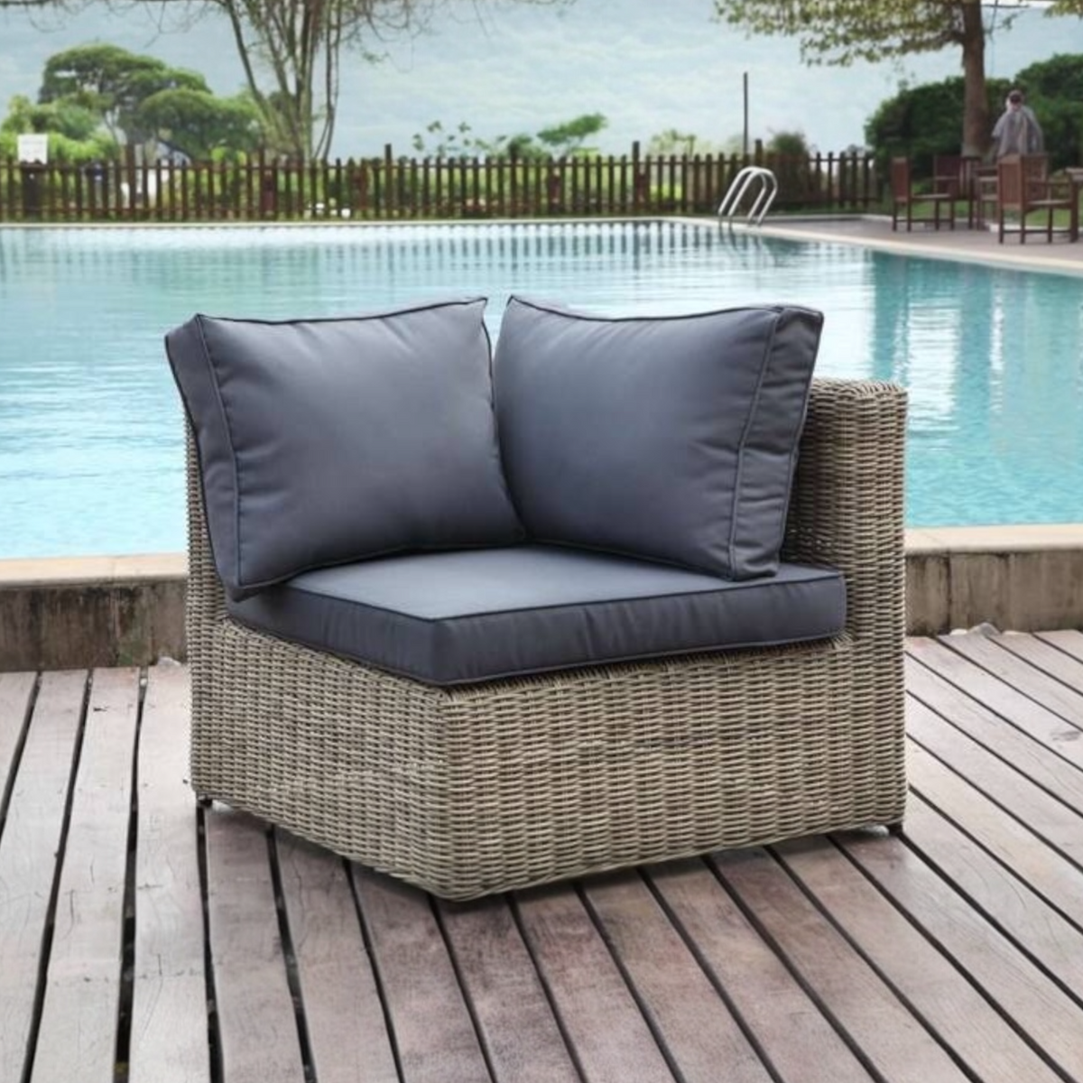 Liberty round resin wicker corner chair – shown outdoors