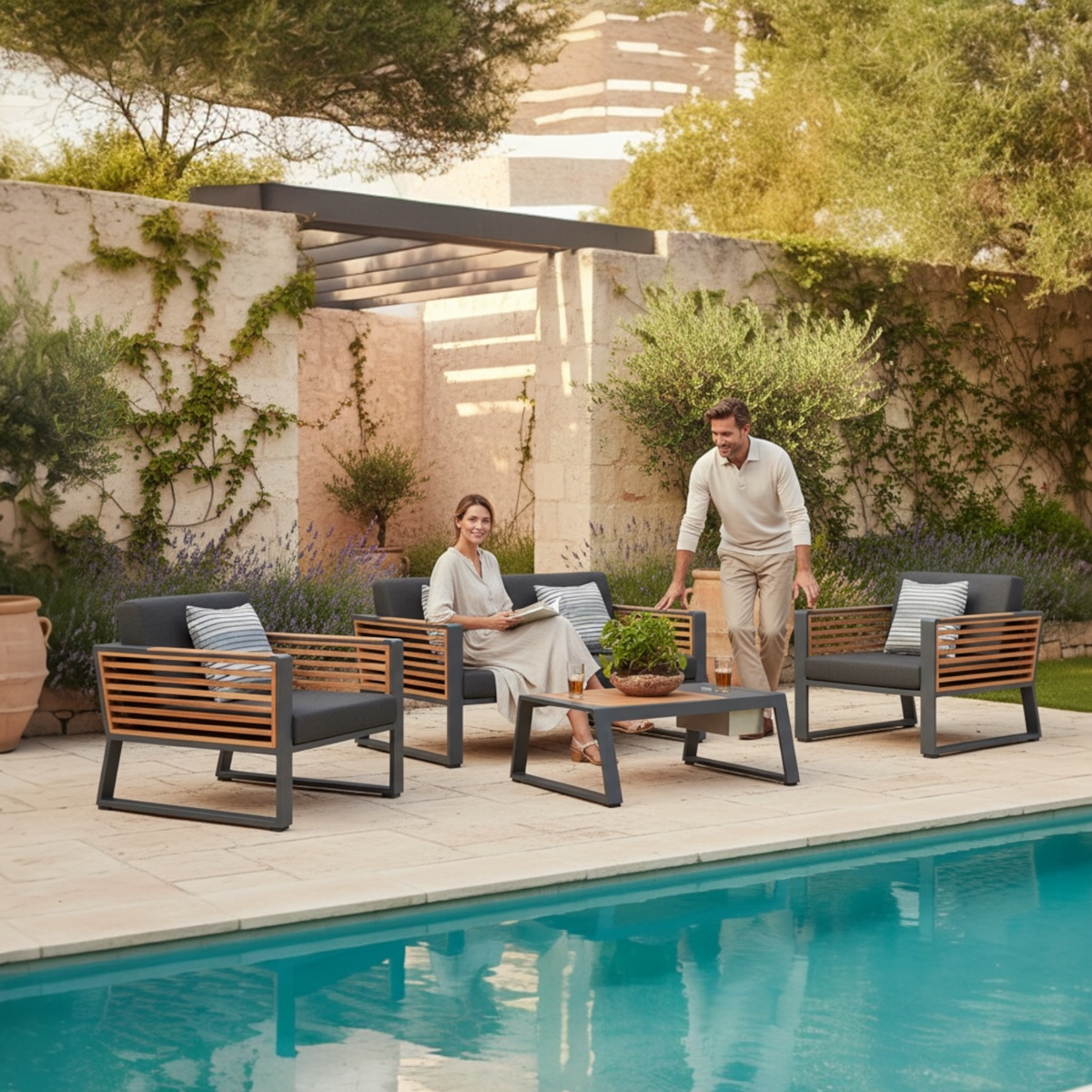 Cofy Mini black aluminum loveseat patio set with teak cooler coffee table – shown outdoors