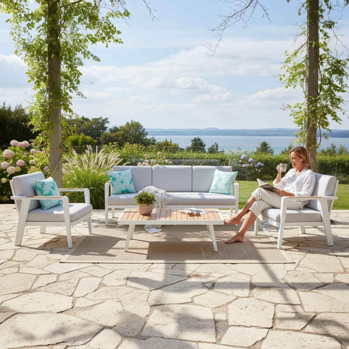 Lovy white aluminum and teak 5-seat patio set with light cushions – shown outdoors