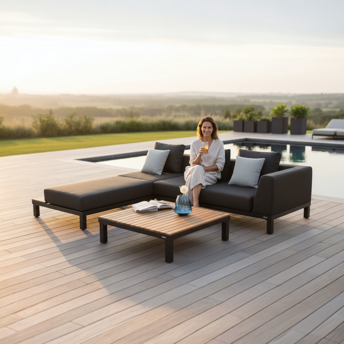 July aluminum and teak lounge set with chaise and teak coffee table – shown outdoors