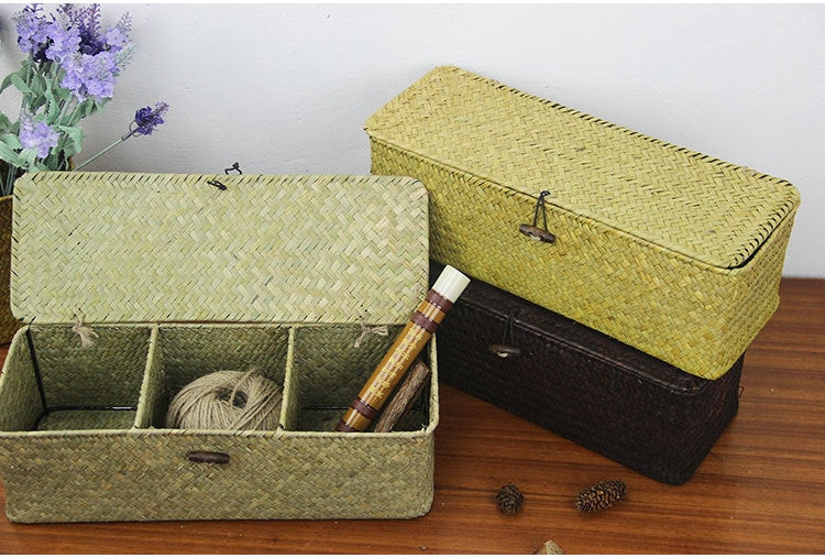 Three-compartment rattan and wicker storage box with a lid – shown in a room setting