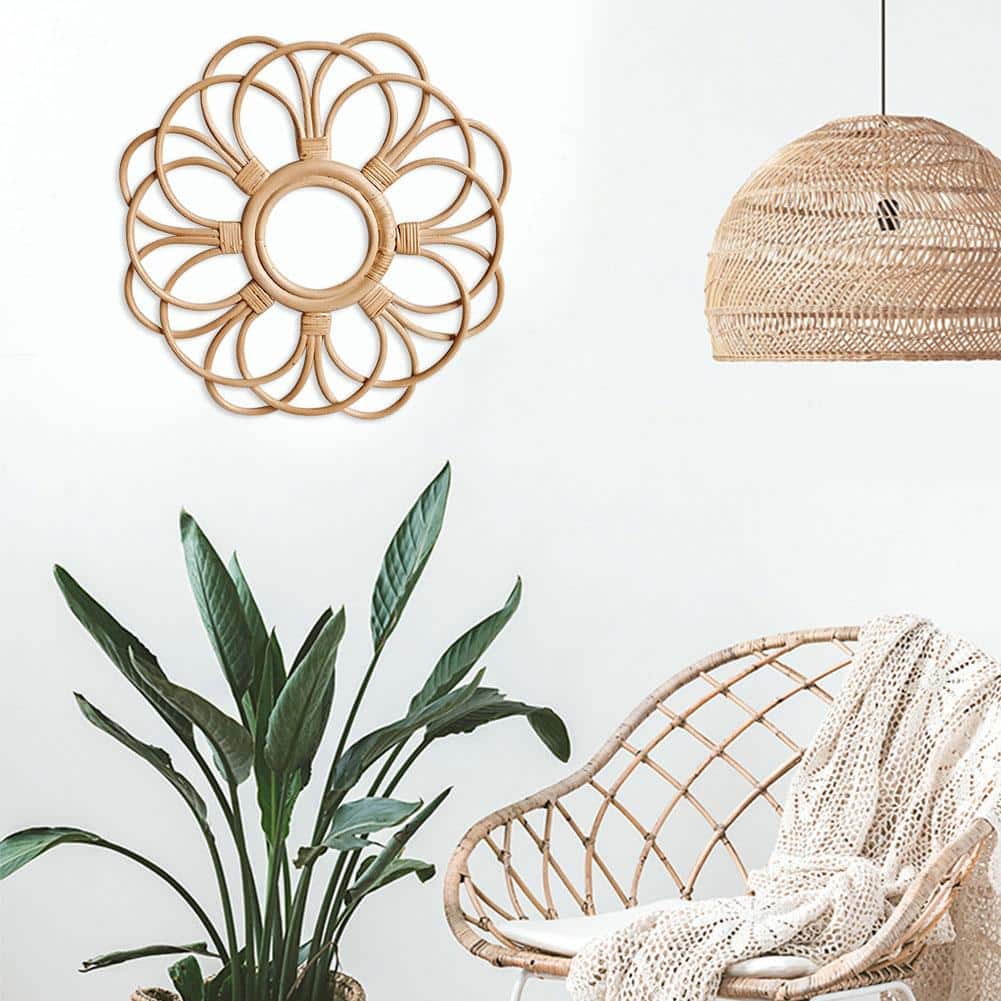 Round floral rattan wall frame with hand-braided petals – shown in a room setting