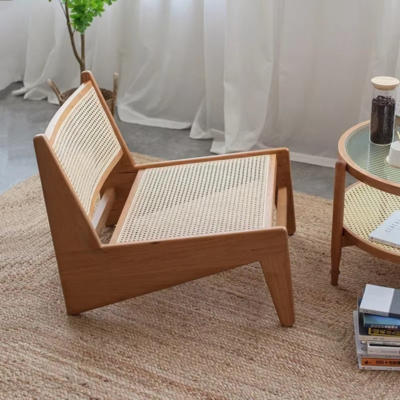 Low Nordic wicker chair with a generous seat – shown in a room setting (2)