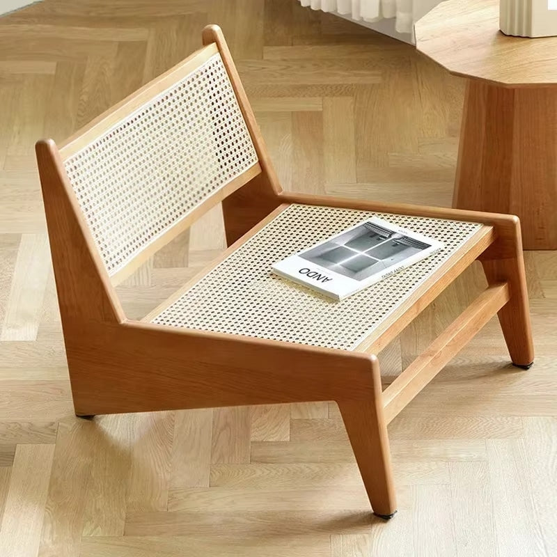 Low Nordic wicker chair with a generous seat – shown in a room setting