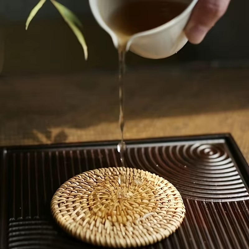 Sturdy round natural rattan coaster – shown in use