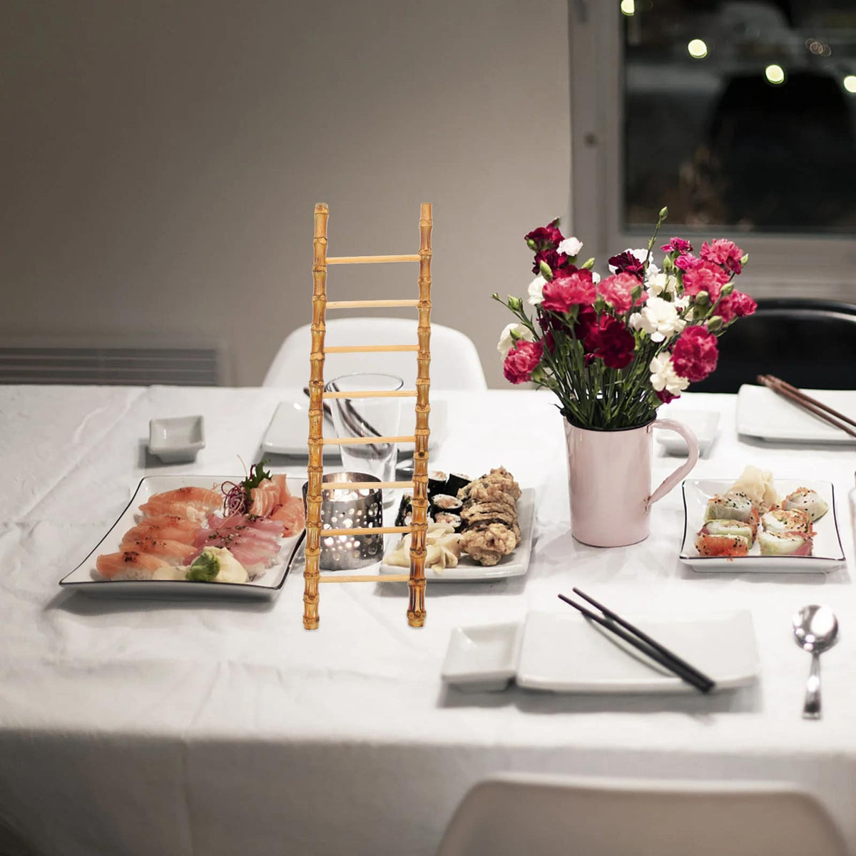 Slim decorative bamboo ladder leaning against a wall – shown in a room setting