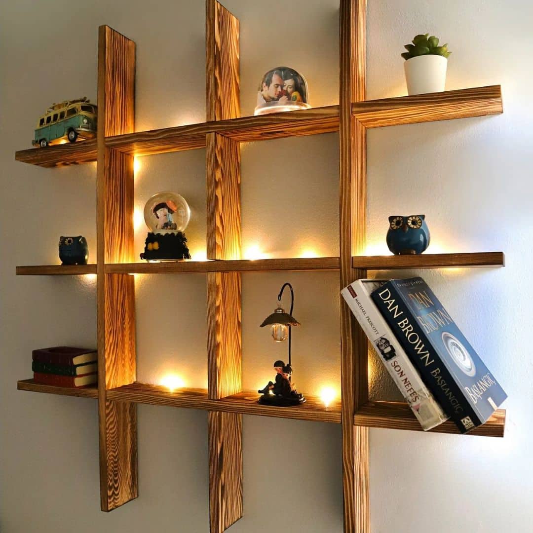 Light wood wall shelf with hand-braided side uprights – shown in a room setting