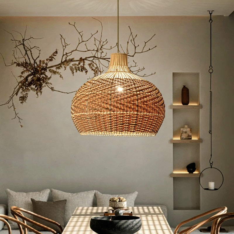 Vintage round rattan pendant light with wood accents – shown in a room setting