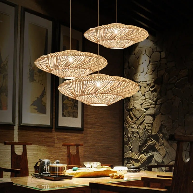 Chinese-style handwoven rattan lantern pendant light – shown lit in a room setting