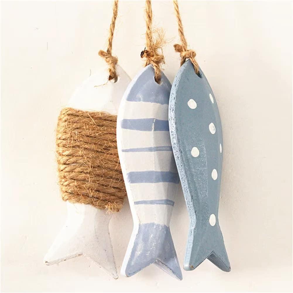 Set of three wooden fish in graduated sizes – shown in a room setting