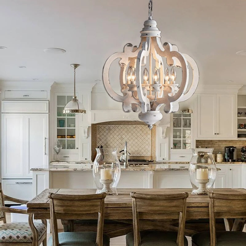 Retro handcrafted wood chandelier with visible filament bulbs – shown in a room setting (2)