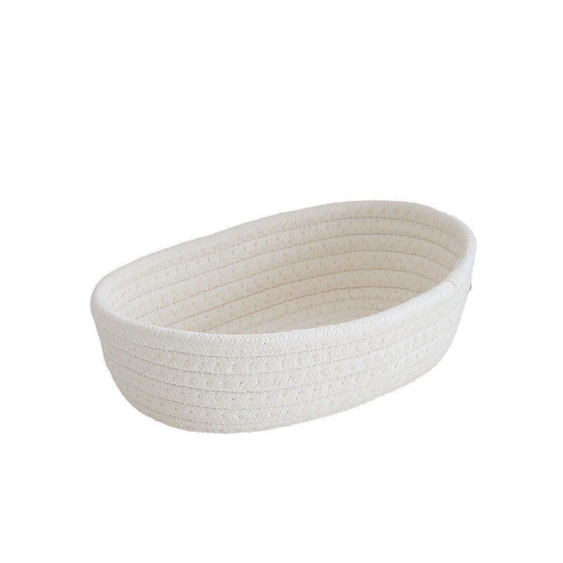 White oval handwoven cotton rope storage basket