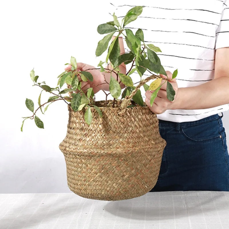 Round natural wicker flower basket with sturdy handles – shown in a room setting (2)